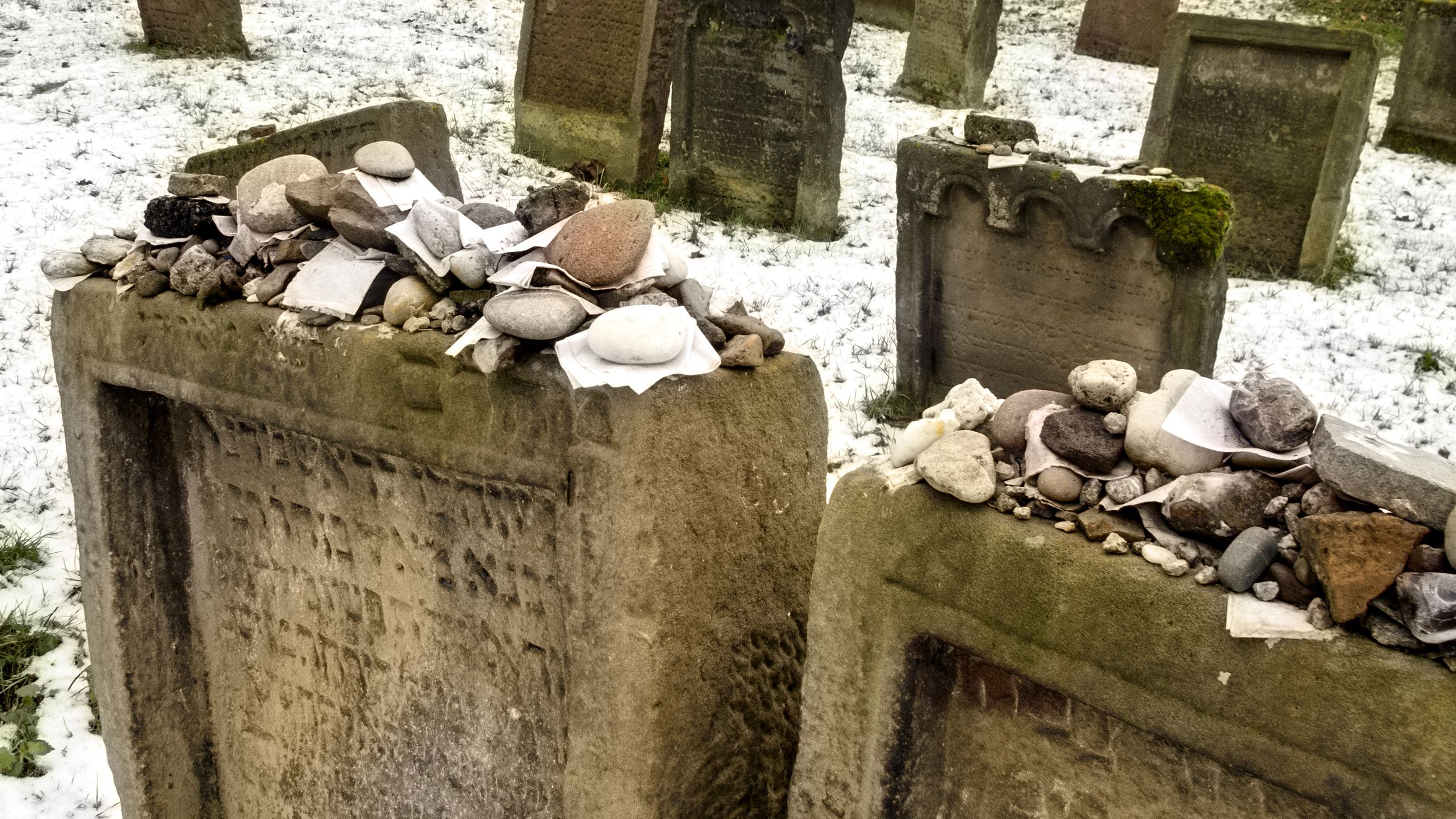 Two Gravestones with Rocks Placed Atop
