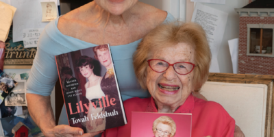 Tovah & Dr. Ruth grin holding copies of their respective books.